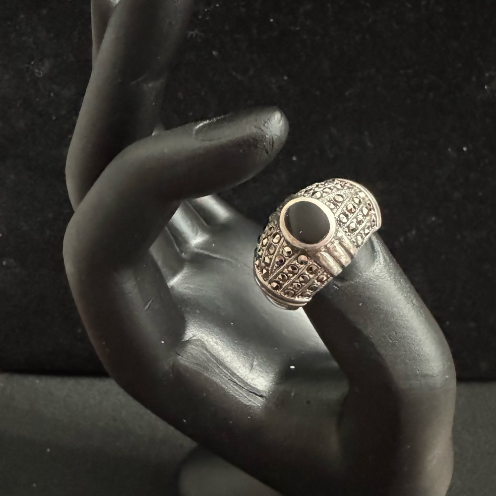 Black Onyx and Marcasite Ring. Dome is surrounded w/vibrant Marcasite stones.